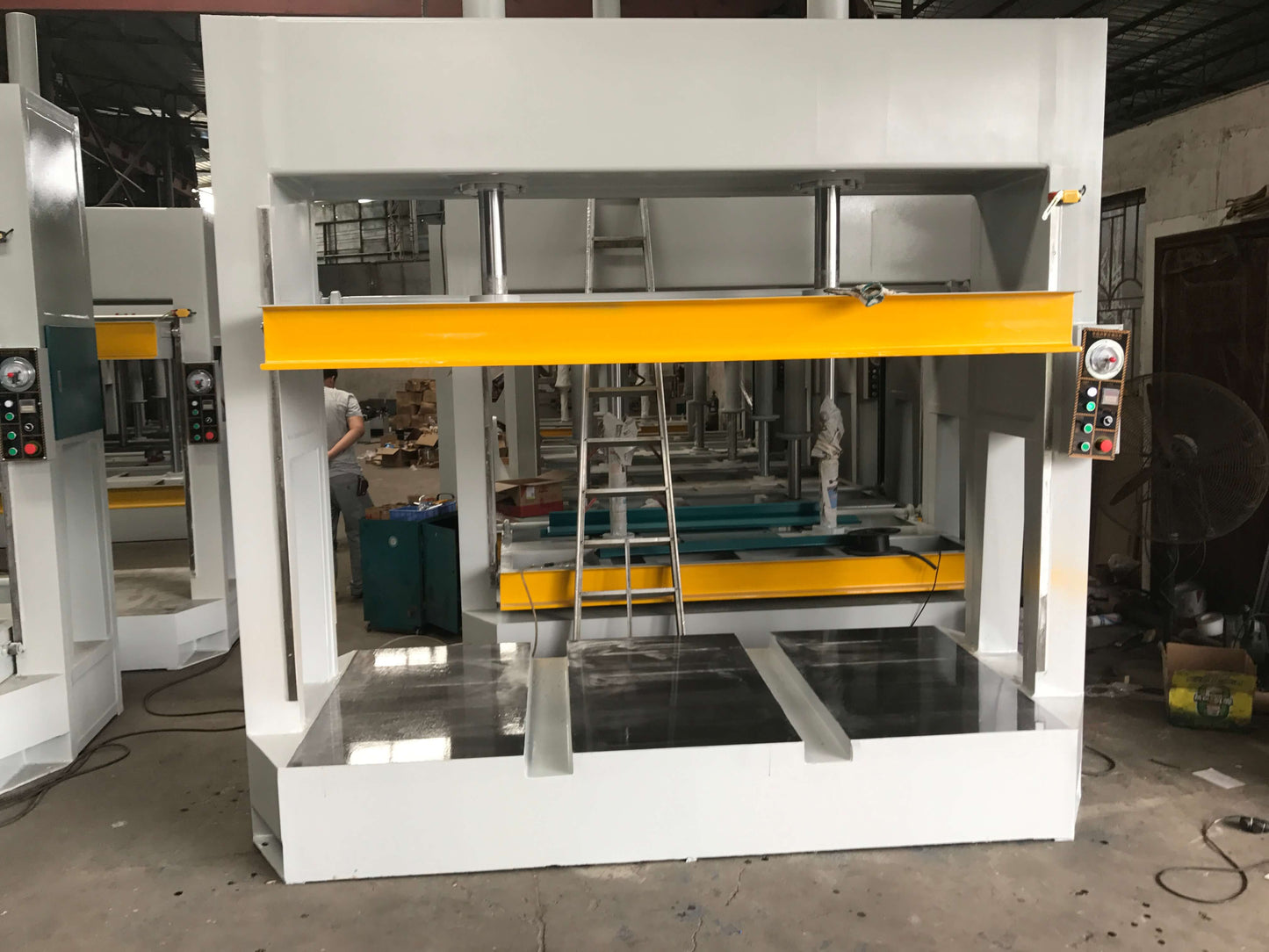 Conventional cold press with forklift slot.